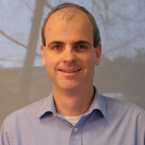 Mason SEOR professor and department chair John Shortle has balding hair and wears a light-blue shirt in his profile