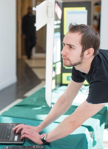 Mason engineering student works on laptop